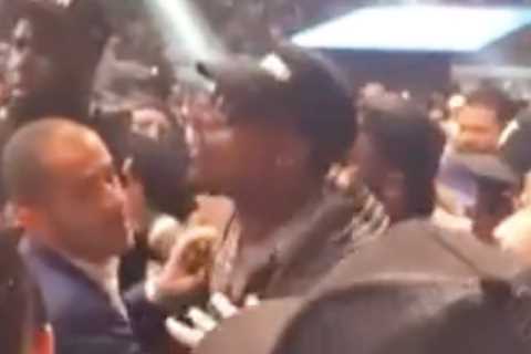 Watch as boxing rivals Jermall Charlo and David Benavidez are forced apart after clashing at Errol..