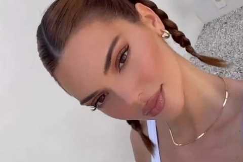 Kendall Jenner winks and shows off her toned abs in new video as fans think star got lip fillers..