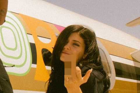 Kylie Jenner looks unrecognizable as she flips off camera with baby daddy Travis Scott in..