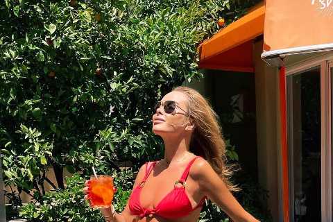 Britain’s Got Talent’s Amanda Holden shows off her sensational body in tiny red bikini