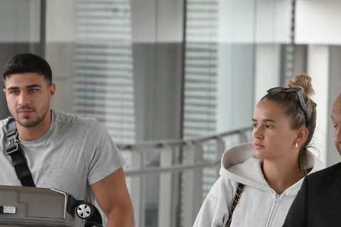 Molly-Mae Hague and Tommy Fury wheel FIVE giant suitcases home before feasting on Dominos pizza at..