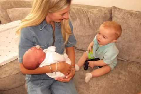 Dani Dyer cuddles newborn after sparking engagement rumours with West Ham boyfriend Jarrod Bowen
