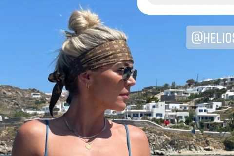 A Place In The Sun Dannii Menzies looks incredible as she shows off tattoos in skimpy bikini in..