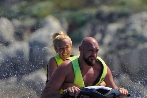 Tyson Fury and wife Paris cruise the waves on jet skis as boxing champ enjoys luxury holiday aboard ..