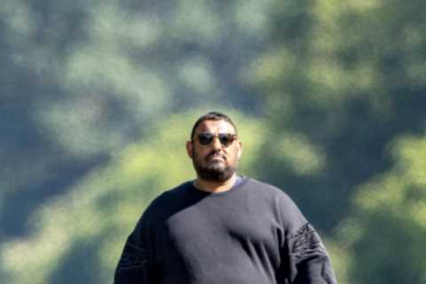 Prince Naseem Hamed looks unrecognisable on dog walk after moving next to Queen in Windsor