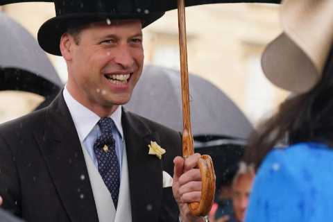 Prince William and Kate Middleton are all smiles despite the rain as they step in for Queen at..