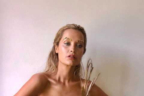 Love Island host Laura Whitmore wows in tiny gold dress as she teases theme for new series