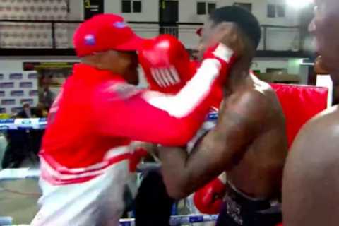Watch shocking moment boxer’s trainer enters ring after final bell and ATTACKS triumphant opponent