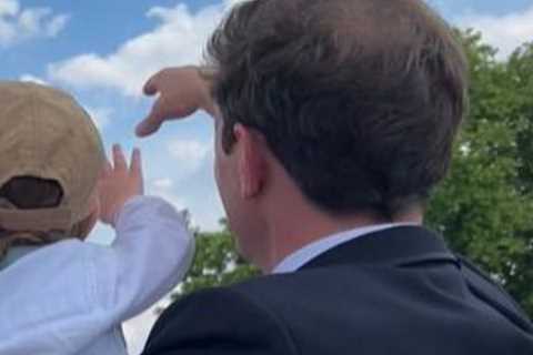 Princess Eugenie and baby son August, 1, wave at Platinum Jubilee flypast from Buckingham Palace..