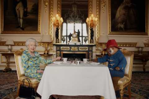 Queen reveals what’s inside her handbag while having tea with cheeky Paddington Bear in sweet..
