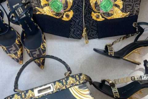Kim Kardashian shows off $3.5K purse &amp; $4.5K Versace x Fendi jacket after fans slammed her for..