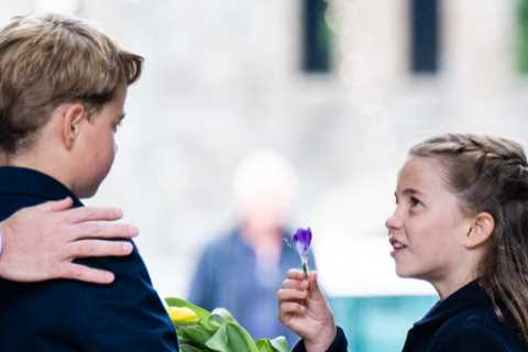 Royal fans touched by sweet moment Princess Charlotte gives big brother Prince George a flower on..
