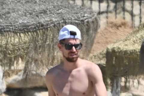 Chelsea star Jorginho cosies up to stunning girlfriend Catherine Harding as pair relax on holiday..