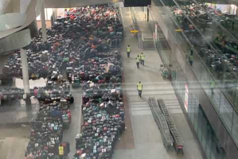 Hundreds of suitcases pile up in Heathrow Airport chaos as passengers told they may not get luggage ..