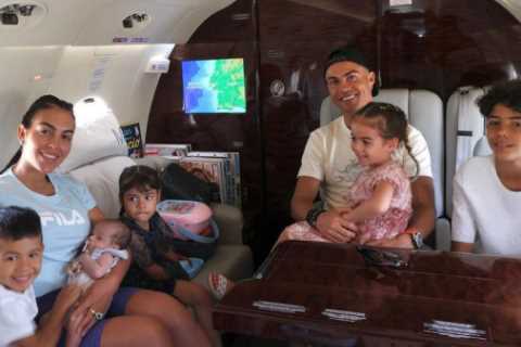 Georgina Rodriguez proudly cradles baby Bella Esmerelda as Cristiano Ronaldo and family jet off on..