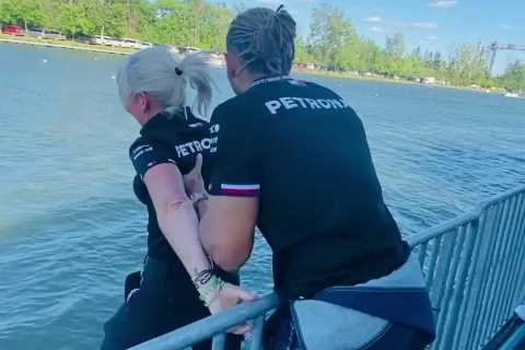 Watch Lewis Hamilton push Mercedes physio into river after she bet against seven-time F1 champ at..