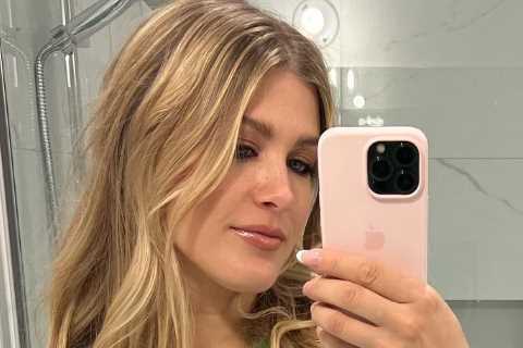 Tennis stunner Eugenie Bouchard turns heads while wearing open top with lacy bra out during..