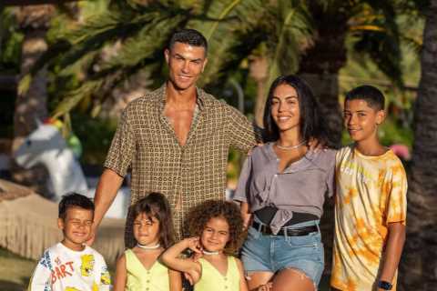 Man Utd star Cristiano Ronaldo and Georgina pose with kids and family friends in cute Majorca..