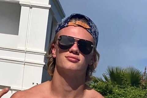 New Man City star Erling Haaland plays football with kids on a beach and shows off new hairstyle..