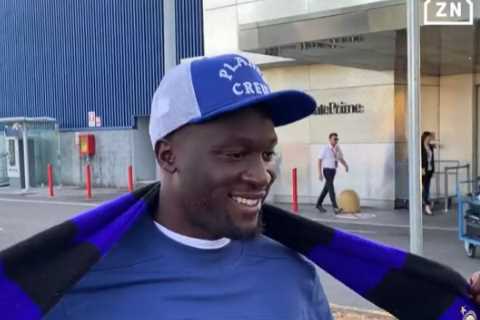 Chelsea flop Romelu Lukaku holds up Inter Milan scarf as striker lands in Italy to seal £6.9m..