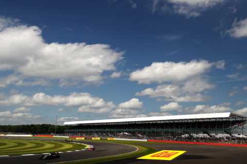 British Grand Prix chaos as huge FIRE breaks out just moments before Lewis Hamilton and Co start..