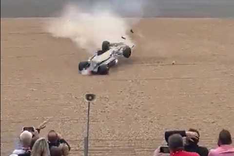 Watch terrified spectators run for their lives as Zhou Guanyu’s car rolls upside down towards them..