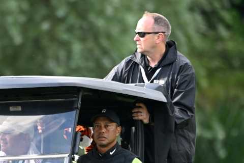 Tiger Woods a huge doubt for The Open as hobbling legend forced to use golf buggy between shots at..