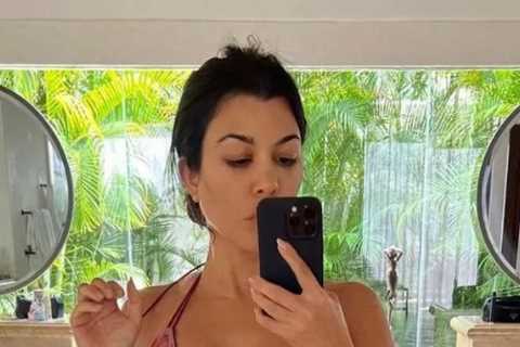 Kourtney Kardashian flaunts curves &amp; bare stomach in teeny bikini as fans think she’s pregnant..