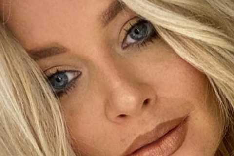 Emily Atack goes braless in very low cut white top