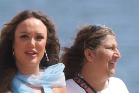 Charlotte Crosby cradles her baby bump in frilly blue dress as she films on the beach in Sunderland