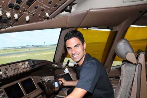 Mikel Arteta sits in cockpit of Arsenal’s private jet before stars are swarmed by fans as they..