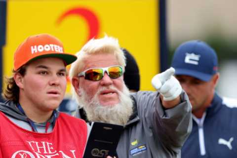 John Daly tees off for The Open with Hooters golf bag as his caddy, son John II, wears matching hat ..