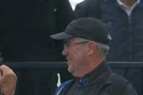 Hilarious moment as spectator at The Open gets trapped inside his own PONCHO during strong winds at ..