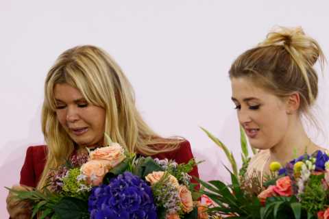 Michael Schumacher’s wife Corinna breaks down in tears on stage as seven-time F1 champ is honoured..
