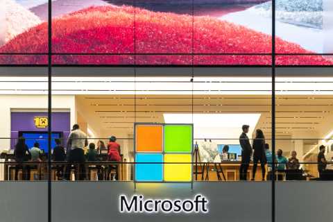 Microsoft reports earnings that fall short of already-reduced expectations.
