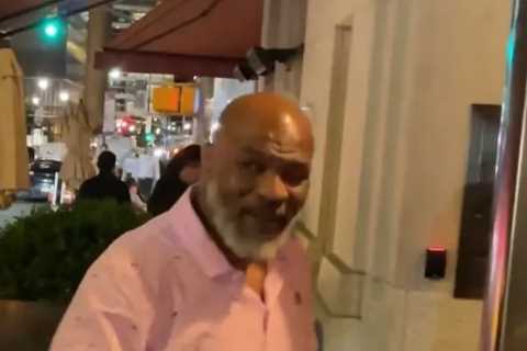 Fearsome Mike Tyson, 56, pictured using a walking stick as ex-heavyweight champion arrives at New..