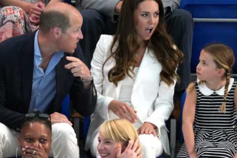 Princess Charlotte, 8, grins as she watches Commonwealth Games swimming race with mum Kate..
