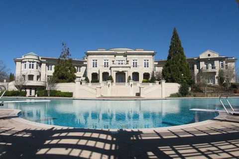 Evander Holyfield’s amazing 109-room Georgia home he sold to Rick Ross for $5.7m boasts bowling..