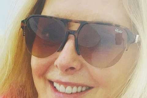 Carol Vorderman shows off her rock hard abs as TV star, 61, goes for a morning swim