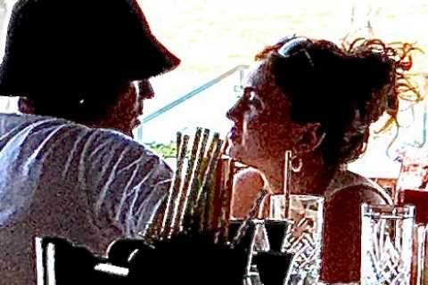 Maisie Smith and Max George look smitten as they toast their romance in Crete