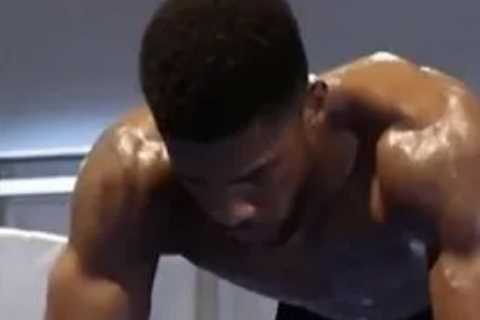 Watch hench Anthony Joshua’s gruelling wrist exercise as he shows off incredible physique in..