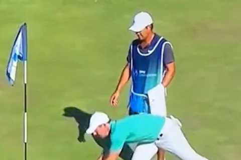 Watch fuming Rory McIlroy throw fan’s remote control golf ball into water before security kick..
