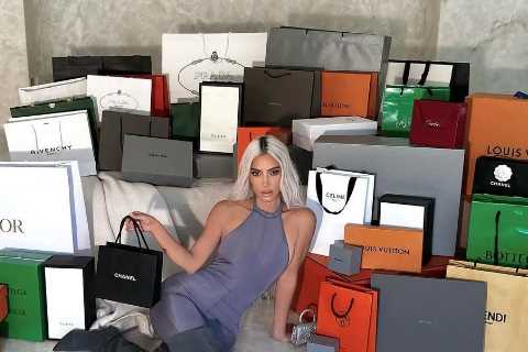 Kardashian fans slam Kim as ‘tasteless’ for posing with a mountain of designer bags after outrage..