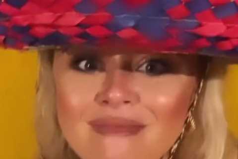 Emily Atack drinks cocktails in plunging dress after hitting the beach on holiday