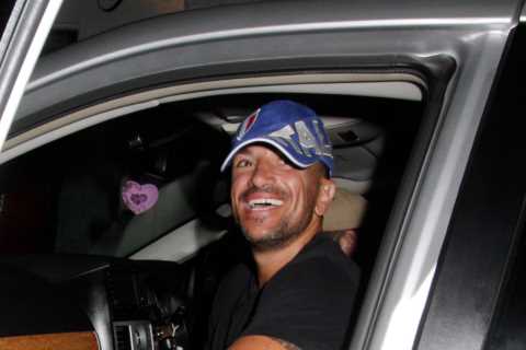 Peter Andre is all smiles as he leaves Grease musical in a T-shirt and shorts