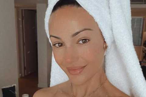 Michelle Keegan reveals flawless skin as she poses in just a towel in hotel room