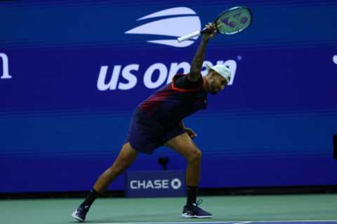 Nick Kyrgios clashes with fans, smashes racket, throws bottle on court and spits towards his team..