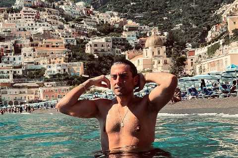 James Argent looks slimmer than ever as he poses topless while swimming in Italy
