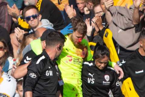 Barnsley star Brad Collins covered in blood after suffering horrific head gash which caused 14..
