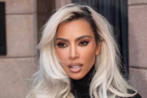Kim Kardashian shows off her tiny waist and dramatic hair makeover as she struts in Dolce &amp;..